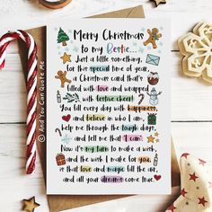 a christmas card with the words merry christmas written in different languages on it next to candy canes and cookies