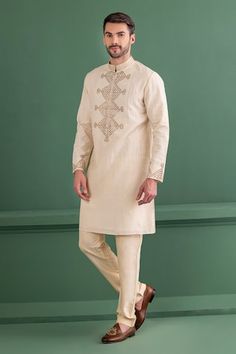 Cream kurta with metal applique embroidery in geometric pattern. Paired with matching aligadhi pant. - Aza Fashions Straight Kurta With Geometric Embroidery For Transitional Season, Transitional Straight Kurta With Geometric Embroidery, Fitted Traditional Wear With Geometric Embroidery For Transitional Season, Fitted Traditional Wear With Geometric Embroidery, Traditional Cotton Sets With Geometric Embroidery, Traditional Wedding Wear With Geometric Embroidery, Straight Kurta With Geometric Embroidery In Chanderi, Chanderi Straight Kurta With Geometric Embroidery, Traditional Kurta With Geometric Embroidery For Eid