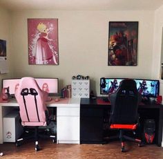 two computer desks with pink chairs and pictures on the wall