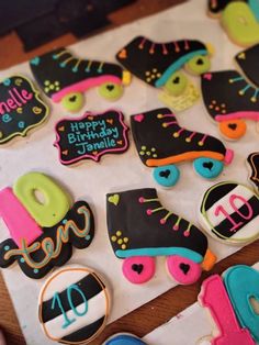 decorated birthday cookies are displayed on a table