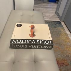 a book sitting on top of a white couch