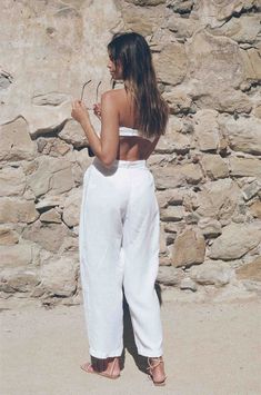 Vintage inspired white linen trousers, yes please! These natural dyed white linen trousers scream lets go on vacation and have ourselves a good time. They come with a linen tie that can be used as a matching tie top or hair tie. The tie is small, so we don't recommend expecting a full set out of it unless you are super tiny in the bust area. The white linen trouser has pleat detail in the front, belt loops and a dyed button for closure. The white linen trousers are pre shrunk for ultimate qualit White Linen Wide Leg Casual Pants, Casual White Linen Wide Leg Pants, White Linen Wide Leg Vacation Pants, White Linen Wide Leg Pants For Vacation, High-waisted Linen Wide Leg Pants For Beach, White Linen Pants For Beach, White Linen Pants For The Beach, Summer Beach Linen Wide Leg Pants, White Linen Pants For Spring