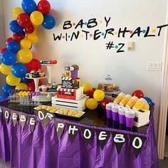 a baby shower party with balloons and desserts