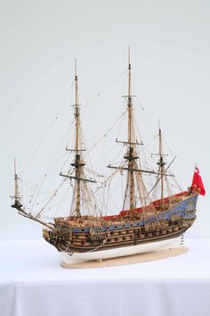 a model ship on a white table cloth