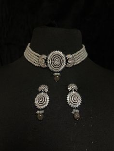 Indian Grey Ladies' Bridal Choker & Earrings of CZ crystal pendant & Gray Onyx multilayer strands Contemporary Indian bridal set with multilayered bead strands choker and CZ stone earrings. This bridal choker jewelry set is accented with grey onyx & CZ stone setting pendant making it one of a kind. Gold plated choker with grey onyx drops adorns this bridal choker necklace.  This modern choker is sure to make you feel like a million bucks with its elaborating layered onyx strands in a handcrafted Pakistani Wedding Jewelry, Indian Jewelry Set, Wedding Pakistani, Pendant Making, Gray Necklace, Bridal Choker, Choker Jewelry, San Ramon, Indian Jewelry Sets