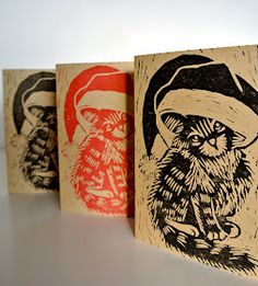 three christmas cards with an owl and santa clause on them, lined up against a white background