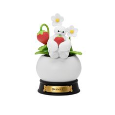 a white teddy bear sitting on top of a flower pot