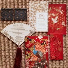 the wedding stationery is laid out on a mat