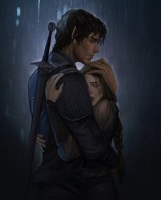 a man and woman hugging in the rain