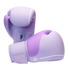 two purple boxing gloves sitting on top of each other