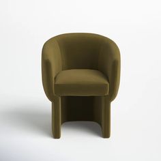 a green chair sitting on top of a white floor next to a black object in the middle