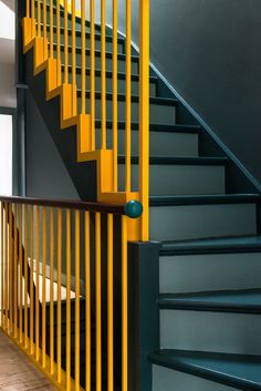 the stairs are painted blue and yellow