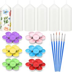 several different types of candles and paint brushes