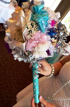 a bridal bouquet being held by someone