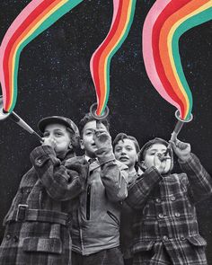 three children holding rainbow sticks in front of their faces and looking up at the sky