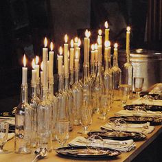 a long table with many candles on it