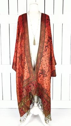 "Handmade orange and black paisley pashmina kimono cover up jacket with custom regular and maxi lengths and optional fringe detail Measurements...taken flat - width across seam to seam: 46\" - regular length with fringe: 38\" - regular length without fringe: 34\" - Maxi length is as selected with or without fringe Features... - lovely soft woven medium weigh pashmina fabric - bohemian oversized flowing design - cardigan style with an open front and generous arm holes - universal design allows a Cheap Open Front Kimono For Fall, Luxury Bohemian Shawl For Fall, Cheap Bohemian Shawl, Plus Size Orange Kimono, Luxury Bohemian Shawl With Fringe, Luxury Bohemian Fringe Shawl, Luxury Red Bohemian Kimono, Eclectic Clothes, Cover Up Jacket