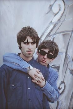 two young men standing next to each other