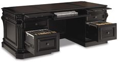 an office desk with two drawers on each side