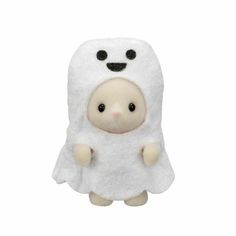 a white stuffed animal with black eyes and a ghost costume on it's head