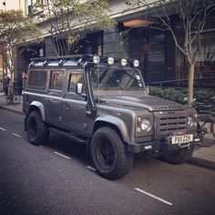 an suv is parked on the side of the road