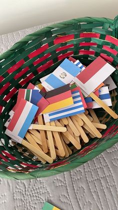 small flags are placed in a green basket