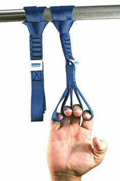 a hand holding onto two blue straps attached to a metal pole