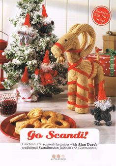 an advertisement for go scandii with a stuffed elephant and pretzels in front of a christmas tree