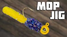 the mop jig is yellow and blue with a hook on it's end