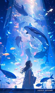 a woman standing under an aquarium filled with dolphins and other marine creatures, looking up at the sky