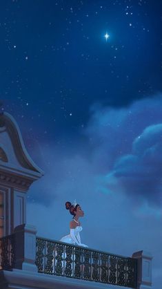 a man and woman kissing on a balcony at night with the stars in the sky