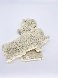 Handmade in Nepal Beautiful crochet fingerless gloves, perfect for fall or winter! Material : Wool with Fleece Lining Measures 8 1/2 inches long x 4 in High quality gloves and stretch to fit most hands. Knit fabric keeps hands warm for outdoor activities during cold weather without adding bulk. Winter White Crochet Knitting Pattern, Winter Cream Knitting Pattern, Cream Knitting Pattern For Winter, Cream Winter Knitting Pattern, Winter Cream Knitted Pattern, Crochet Hand Warmers Aesthetic, Green Arm Warmers, Crochet Flower Fingerless Gloves, Grey Fingerless Gloves