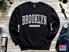 Brooklyn Sweatshirt | Soft Cozy Brooklyn New York Sweatshirt Crewneck Sweater Vintage NYC College University Souvenir Gifts NY  A sturdy and warm sweatshirt bound to keep you warm in the colder months. A pre-shrunk, classic fit sweater that's made with air-jet spun yarn for a soft feel and reduced pilling. * 50% cotton, 50% polyester * Pre-shrunk * Classic fit * 1x1 athletic rib knit collar with spandex * Air-jet spun yarn with a soft feel and reduced pilling * Double-needle stitched collar, sho Brooklyn Sweatshirt, Spurs Basketball, Vintage Nyc, New York Sweatshirt, Embroidery Sweatshirt, College University, Sweatshirt Crewneck, San Antonio Texas, Sweater Vintage