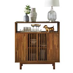 a wooden sideboard with two vases and a dog figurine on top