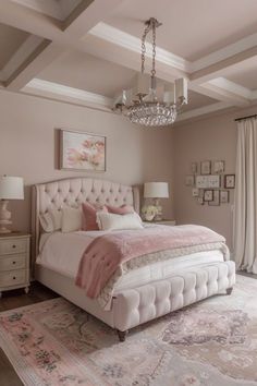 a bedroom with a large bed and chandelier