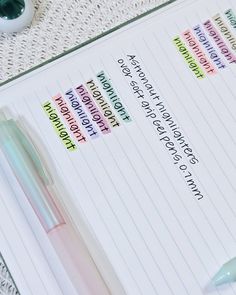 a notepad with some writing on it next to a pen