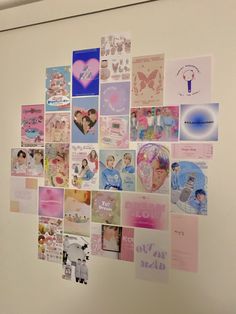 a white wall covered in lots of pictures and magnets on it's side