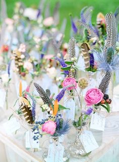 a table topped with lots of flowers on top of it