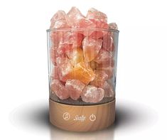 a glass container filled with pink and orange crystals