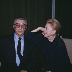 a man and woman sitting next to each other