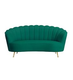 a green couch with gold legs and an oval shaped cushion on the back, sitting in front of a white background