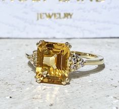 Don't miss this opportunity to own this beautiful gemstone ring crafted in 14k gold filled => Gemstone Type - Citrine, Clear Quartz => Gemstone Cut - Faceted => Gemstone Size - 8*10 mm, 2 mm => Total Number of Gemstones - 7 => Metal Type - 14k Gold Filled (Tarnish Resistant And Nickel Free) - also available in 925 sterling silver * Please contact me for pricing on a sizes larger than 11 * ~ Feel free to ask me about custom made designs. ❏ Replacements and custom orders : ✪ 925 ste Engagement Ring Rectangle, Ring Rectangle, Yellow Citrine Ring, Rough Stone Ring, November Birthstone Jewelry, Rectangle Ring, November Birthstone Ring, Citrine Jewelry, Gold Statement Ring