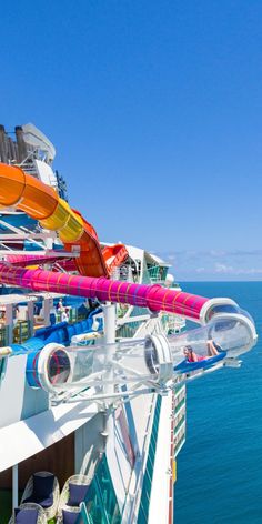 the top deck of a cruise ship with colorful items on it's railings