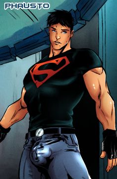 a man in a black shirt with a red superman symbol on his chest and arms