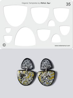 two pairs of earrings are shown in front of a white card with black and yellow designs