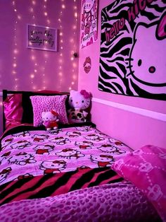 a bedroom decorated in pink and black with hello kitty bedding, zebra print comforter