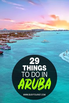 boats in the ocean with text overlay saying 29 things to do in aruba