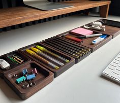 a desk with a keyboard and various office supplies