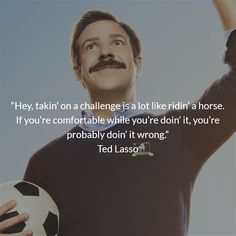 a man with a moustache holding a soccer ball in one hand and a quote from ted lasso on the other