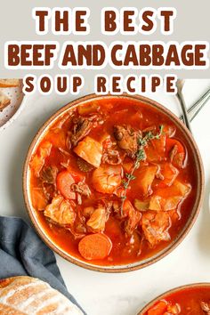 the best beef and cabbage soup recipe in a bowl on a white table with bread